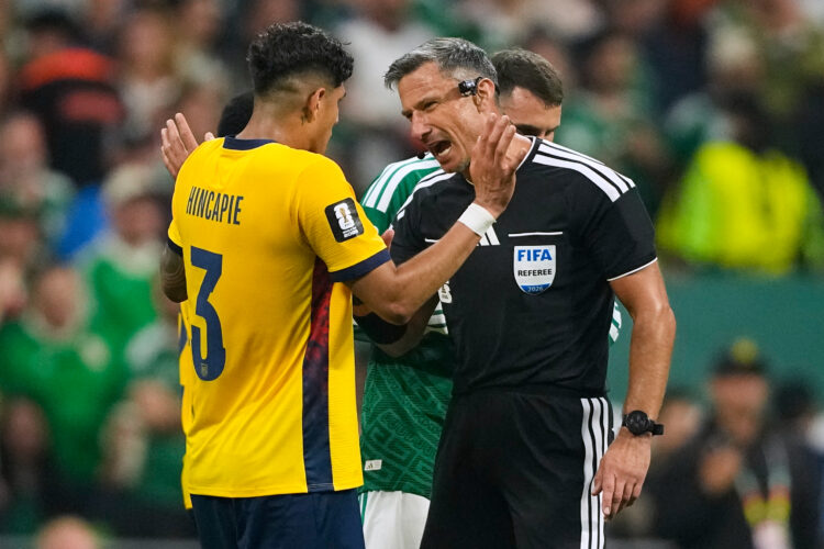 Why are World Cup refs giving red cards to players covering their mouths when confronting opponents?